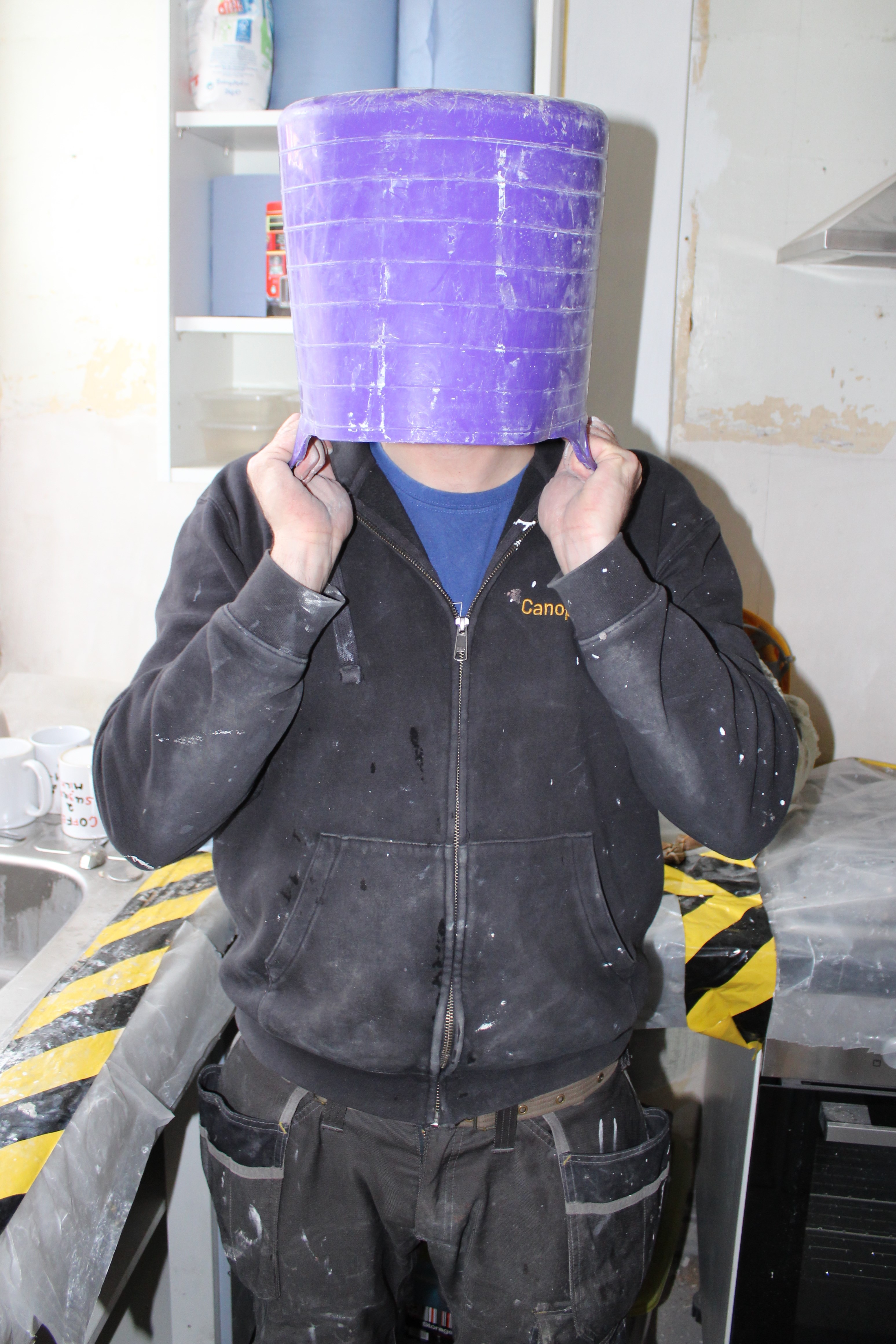 site worker with bucket on head Canopy